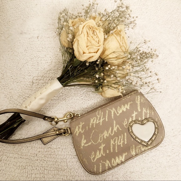 Coach Handbags - 🎈SALE🎈Coach gold heart wristlet